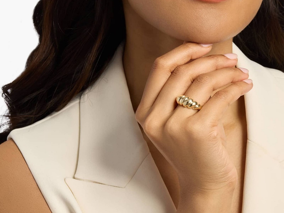 Woman wearing yellow gold dome ring